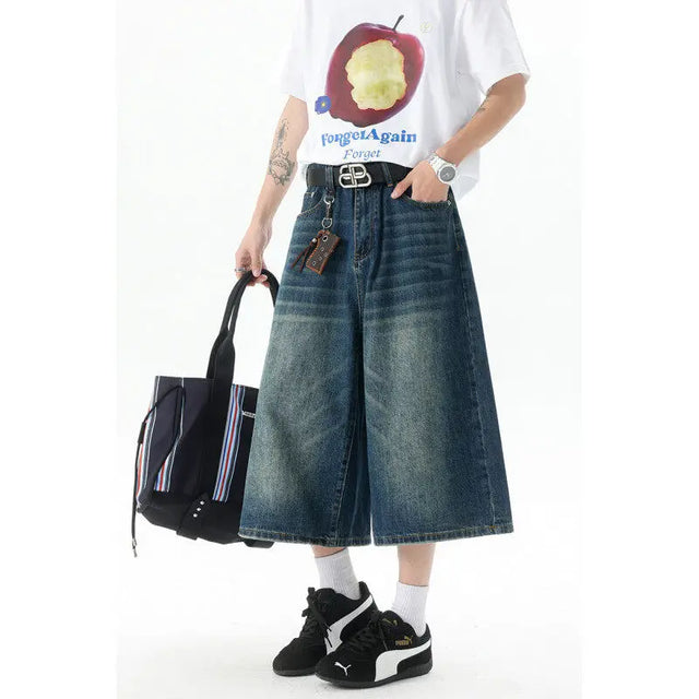 “Model wearing 2025 men’s trendy high-waisted wide-leg cropped jeans in light blue denim – casual summer streetwear look